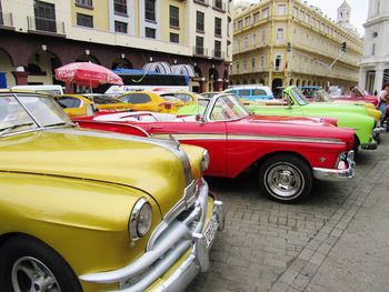 Cars parked on street in city