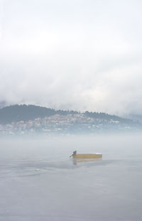 Scenic view of sea against sky during winter