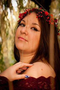 Portrait of beautiful young woman wearing flowers