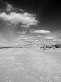 Scenic view of landscape against cloudy sky