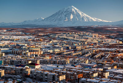 Aerial view of city against sky during winter