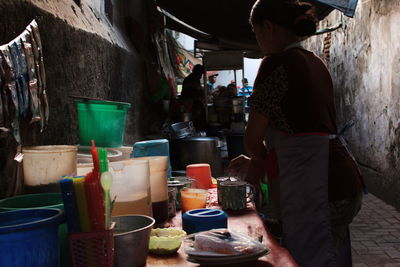 Woman working at market stall