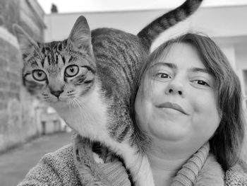 Portrait of cat and woman at home