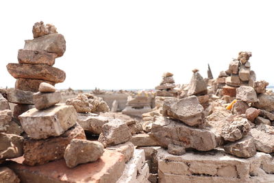 Close-up of stone stack against clear sky