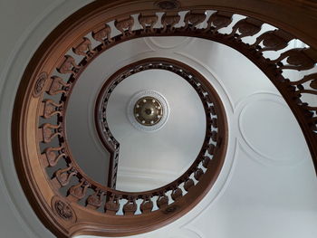 Directly below shot of spiral staircase in building