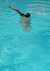 Man swimming in pool