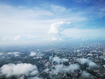 Aerial view of cityscape against sky