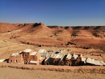 Scenic view of desert against clear sky