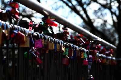 Close-up of padlocks hanging on railing