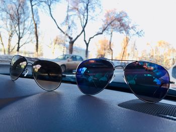 Reflection of sunglasses on side-view mirror