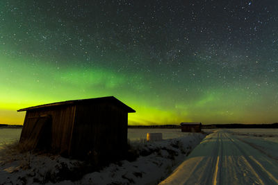 Scenic view of landscape against sky at night