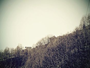 House on field against cloudy sky