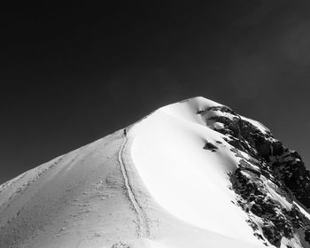 Close-up of sand dunes against clear sky