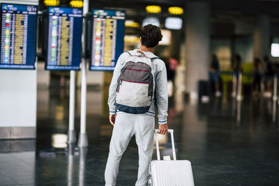 Rear view of man walking in city