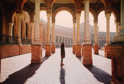 Rear view of woman in historic building