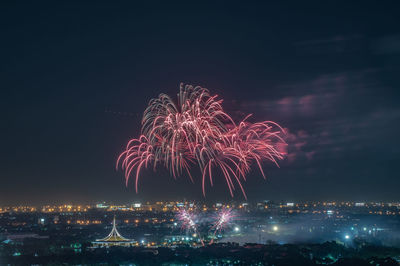 Firework display at night