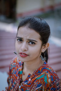 Close-up portrait of woman standing outdoors