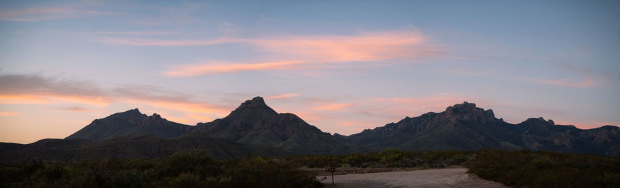 Scenic view of mountains against cloudy sky