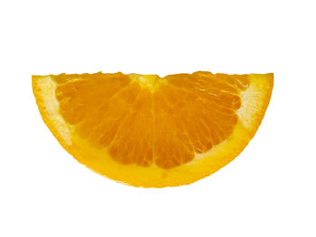 Close-up of orange slice against white background