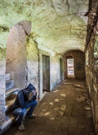 Man in corridor of building