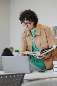 Businesswoman using laptop at office