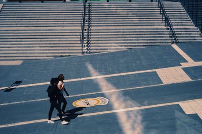 High angle view of man walking on street