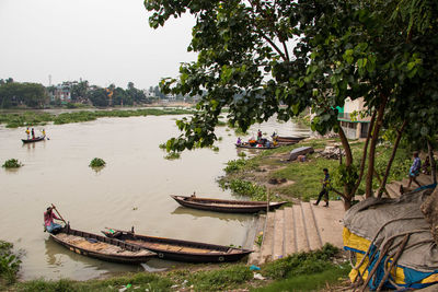 Boats moored at harbor