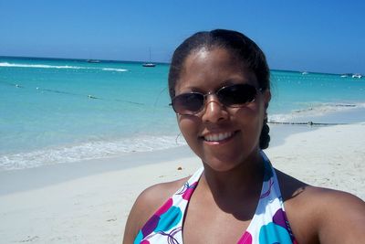 Portrait of smiling young woman on beach