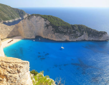 Scenic view of sea against clear blue sky