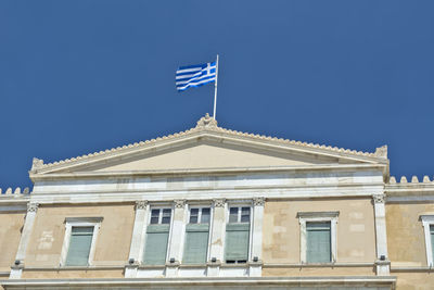 Low angle view of building against blue sky