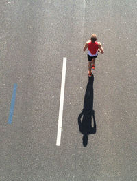 High angle view of man running on road