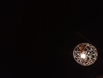 Low angle view of illuminated light bulb