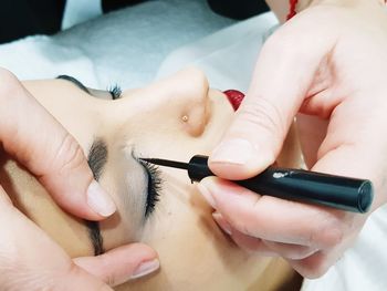 Cropped image of beautician with customer