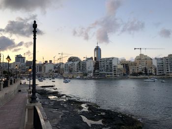 Buildings in city at waterfront in malta