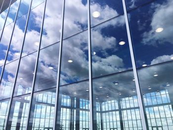 Reflection of clouds on glass building