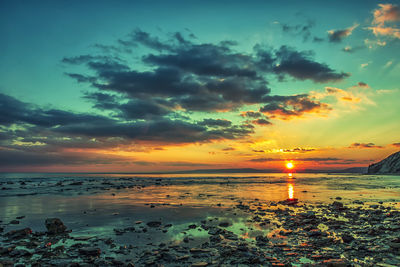 Scenic view of sea against sky during sunset