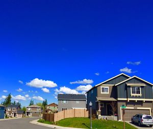 Buildings against blue sky and clouds