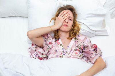 Young woman sleeping on bed