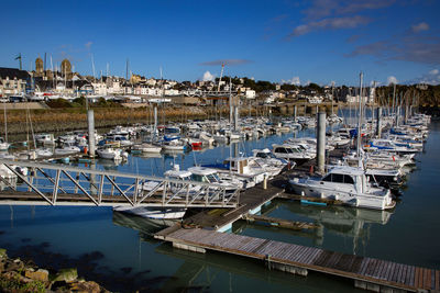 Boats moored at harbor