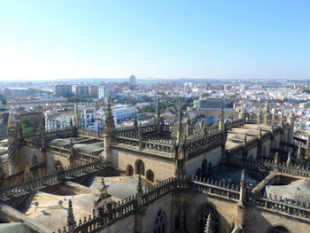 High angle view of city buildings against clear sky