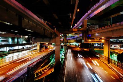 Light trails on road in city at night