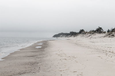 Scenic view of beach against clear sky