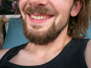 Close-up portrait of a smiling young man