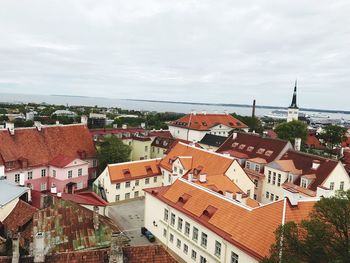 Houses in town against sky