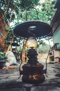 Close-up of electric lamp on table