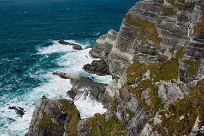 High angle view of cliff by sea