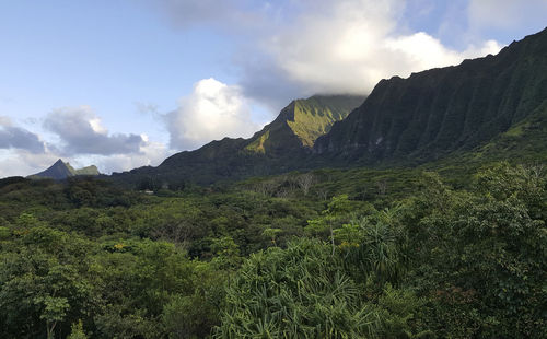 Scenic view of mountains against cloudy sky