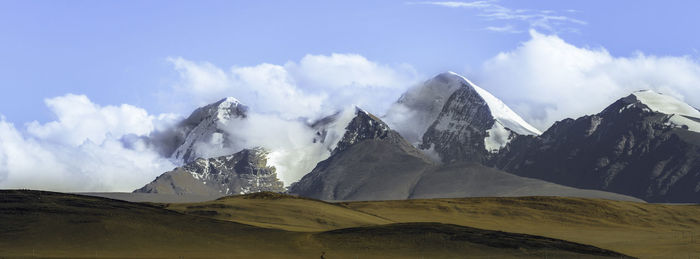 Scenic view of snowcapped mountains against sky