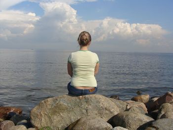 Rear view of man standing on beach