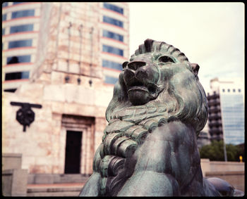 Statue against building